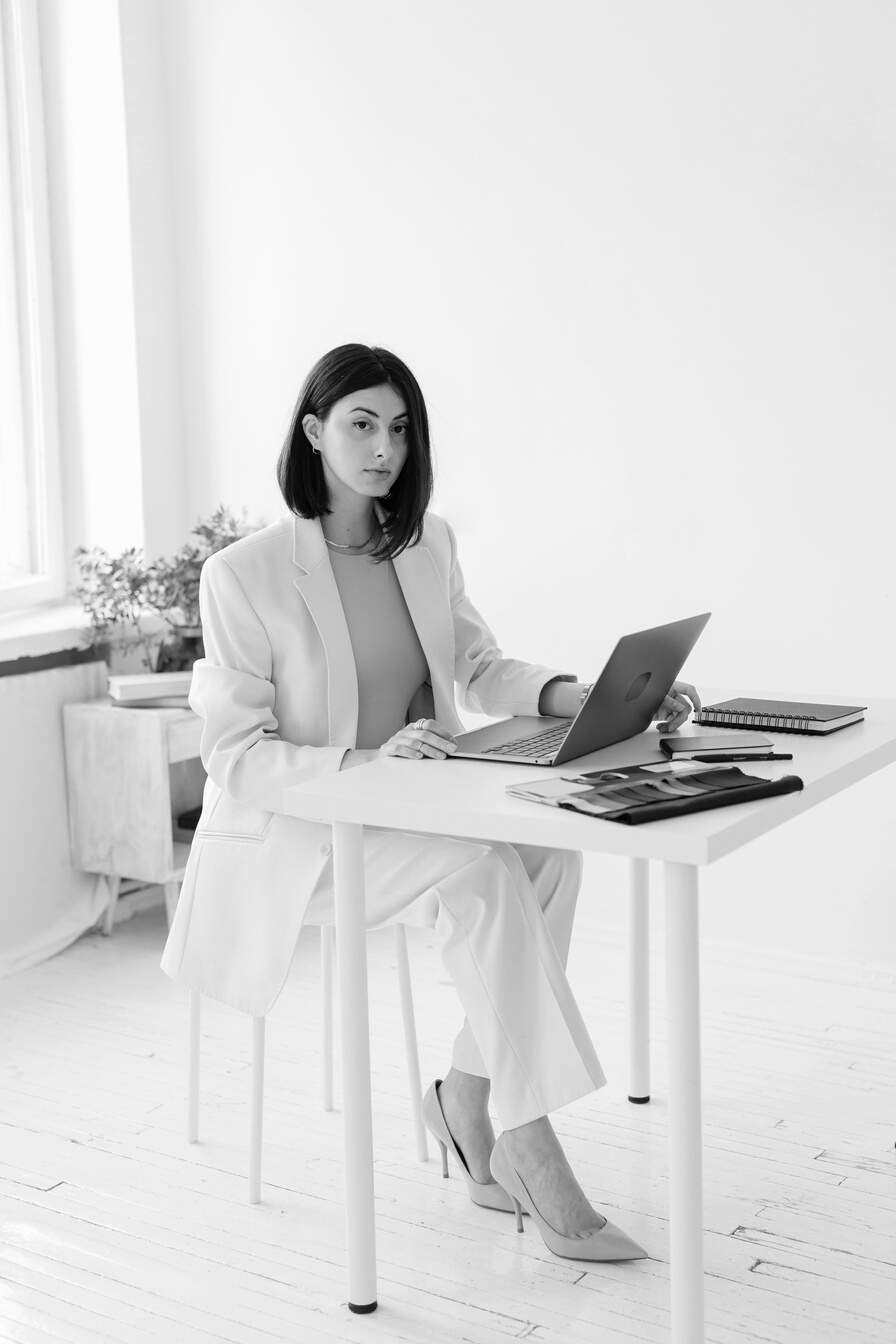 Woman in White Blazer at the Office